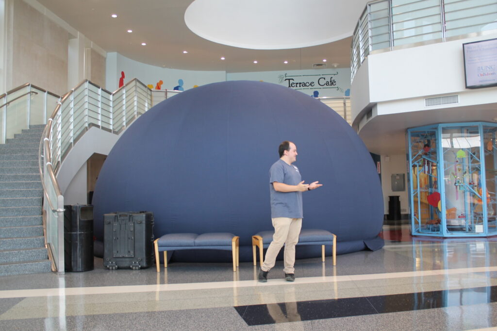 Mobile planetarium dome and educator 