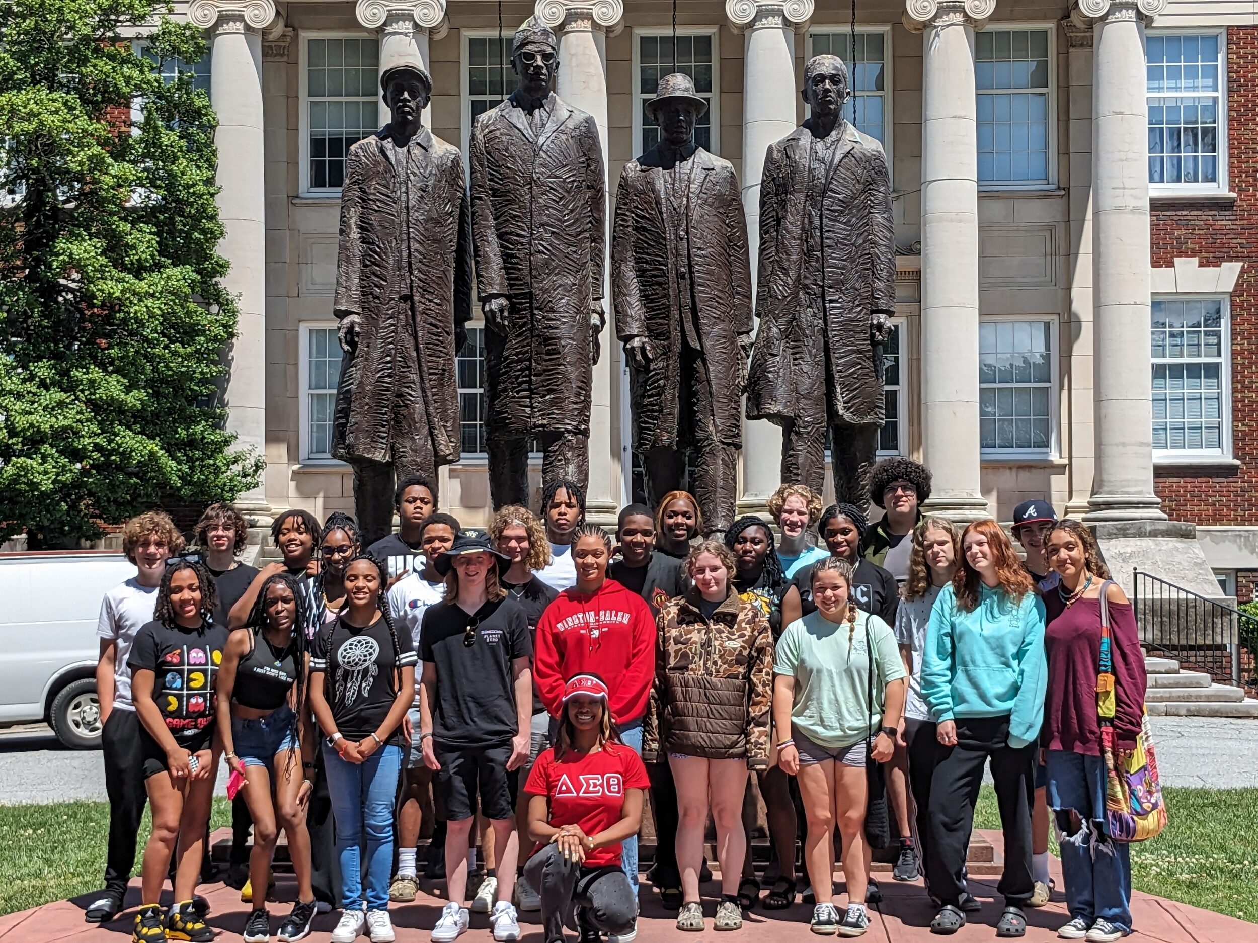 Gates County students at North Carolina Agricultural and Technical State University. They stand in front of statues honoring the Greensboro Four.