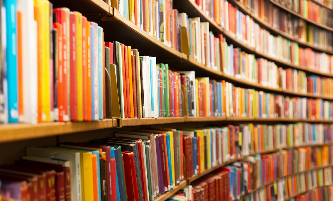 A Library with many shelves and books.