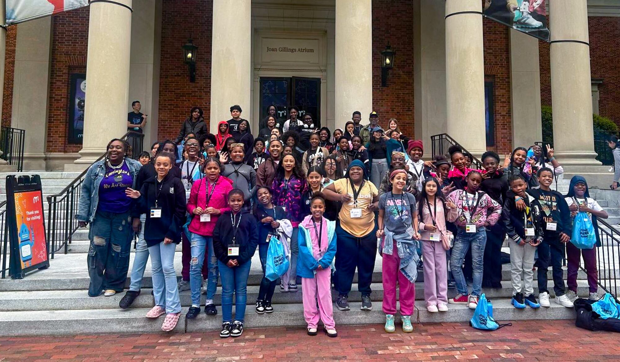 A group of students stand in front of the Morehead building.