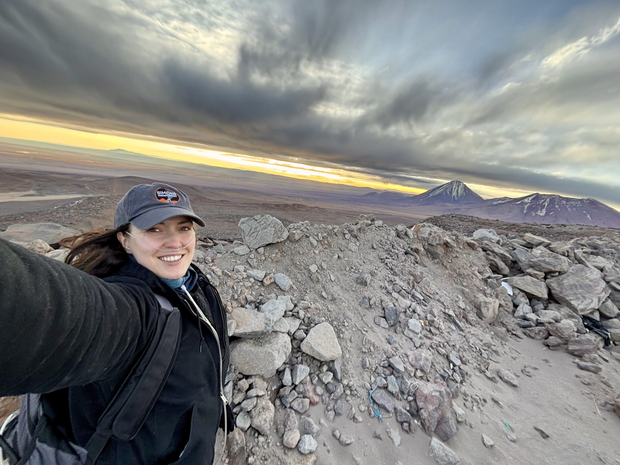 Dr. Eve Vavagiakis takes a selfie at an astronomy site.